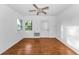 Bright bedroom with wood flooring, fan, and natural light at 224 Georgia Ave, Crystal Beach, FL 34681