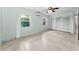 Bedroom featuring dual windows, spacious closet and cooling ceiling fan at 224 Georgia Ave, Crystal Beach, FL 34681