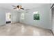 Bedroom featuring dual windows and cooling ceiling fan at 224 Georgia Ave, Crystal Beach, FL 34681