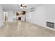 Open living space with a ceiling fan, air conditioning unit, and easy access to the kitchen at 224 Georgia Ave, Crystal Beach, FL 34681
