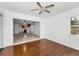Living room with wood floors leading into the kitchen at 224 Georgia Ave, Crystal Beach, FL 34681