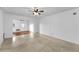 Bright and open living room with a ceiling fan and access to other rooms in the home at 224 Georgia Ave, Crystal Beach, FL 34681
