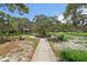 Picturesque park featuring lush trees, benches, and a gazebo for relaxation and enjoyment at 224 Georgia Ave, Crystal Beach, FL 34681