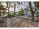 Expansive wooden deck perfect for outdoor gatherings, overlooking neighborhood at 224 Georgia Ave, Crystal Beach, FL 34681
