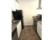 Well-lit kitchen features granite countertops, stainless steel appliances, and tile flooring at 2302 Maki Rd # 2, Plant City, FL 33563