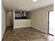 Open concept living space and kitchen with tile flooring and ample natural light at 2302 Maki Rd # 2, Plant City, FL 33563