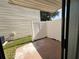 Cozy outdoor patio with a privacy fence and access to the home's interior at 2302 Maki Rd # 2, Plant City, FL 33563