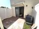 Private outdoor patio with a white fence and sliding door access to the living area at 2302 Maki Rd # 2, Plant City, FL 33563