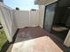 Enclosed patio featuring a white privacy fence and a sliding glass door at 2302 Maki Rd # 2, Plant City, FL 33563
