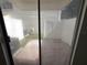 View of the outdoor patio from inside the property through sliding glass doors at 2302 Maki Rd # 2, Plant City, FL 33563