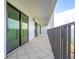 Spacious condo balcony with tile flooring and sliding glass doors offering stunning water views at 240 Sand Key Estates Dr # 243, Clearwater Beach, FL 33767