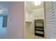 Walk-in closet with shelves and hanging rods, offering ample storage space at 240 Sand Key Estates Dr # 243, Clearwater Beach, FL 33767
