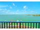 Stunning water view showcasing waterfront homes and boat docks under a clear blue sky at 240 Sand Key Estates Dr # 243, Clearwater Beach, FL 33767