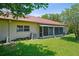Wide backyard view with a covered patio extending from the home's exterior at 2460 Northside Dr # 802, Clearwater, FL 33761