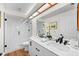 Bright bathroom featuring double sinks, a walk-in glass shower, and contemporary fixtures for a luxurious feel at 2460 Northside Dr # 802, Clearwater, FL 33761