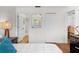 Bedroom showcasing a clean and organized closet with ensuite bathroom, creating a comfortable and functional space at 2460 Northside Dr # 802, Clearwater, FL 33761