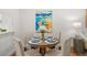Charming dining area featuring seating for four and bright painting at 2460 Northside Dr # 802, Clearwater, FL 33761