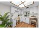 Bright kitchen featuring white cabinetry, modern countertops, and updated appliances, complemented by wood-look flooring at 2460 Northside Dr # 802, Clearwater, FL 33761