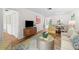The living room shows seating and seamlessly connects to the dining area, creating an inclusive living space at 2460 Northside Dr # 802, Clearwater, FL 33761