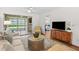 The living room has sliding doors leading to the outdoor lanai and provides access to the bedroom at 2460 Northside Dr # 802, Clearwater, FL 33761