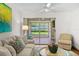 A cozy living room showcases comfortable seating and sliding doors that leads to a screened-in patio at 2460 Northside Dr # 802, Clearwater, FL 33761
