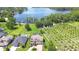 Breathtaking aerial shot of a home, pool, lush landscaping and stunning lake views at 2566 Lake Manor Dr, Land O Lakes, FL 34639