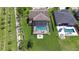 This backyard oasis features a screened-in pool, a fire pit, and a patio, perfect for entertaining and relaxing at 2566 Lake Manor Dr, Land O Lakes, FL 34639