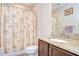 Well lit bathroom featuring granite countertops, and a shower/tub combination at 2566 Lake Manor Dr, Land O Lakes, FL 34639