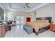 Primary bedroom features a seating area, and double doors to the outside at 2566 Lake Manor Dr, Land O Lakes, FL 34639