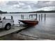 Boat launch with white pick-up truck and boat on trailer ready for lake access at 2566 Lake Manor Dr, Land O Lakes, FL 34639