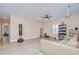 Versatile bonus room, equipped with a projector, fitness equipment, and vinyl flooring at 2566 Lake Manor Dr, Land O Lakes, FL 34639