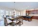 Open concept kitchen and dining room with sliding glass doors leading to the outdoor living area at 2566 Lake Manor Dr, Land O Lakes, FL 34639
