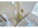 Open foyer features stylish staircase, modern light fixture, and a cozy seating area with a decorative rug at 2566 Lake Manor Dr, Land O Lakes, FL 34639