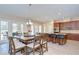 Dining area and kitchen combo with access to backyard, and a large kitchen island at 2566 Lake Manor Dr, Land O Lakes, FL 34639