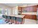 Gourmet kitchen with island seating, granite counters, stainless appliances, and lots of cabinet space at 2566 Lake Manor Dr, Land O Lakes, FL 34639