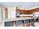 Updated kitchen with stainless appliances, granite counters, and island with bar seating at 2566 Lake Manor Dr, Land O Lakes, FL 34639