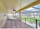 Large lanai with tile flooring, ceiling fans, and a beautiful view of the pool and yard at 2566 Lake Manor Dr, Land O Lakes, FL 34639