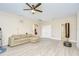 Spacious living room with light colored floors, a ceiling fan, and plenty of space at 2566 Lake Manor Dr, Land O Lakes, FL 34639
