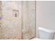 Shower features tile and a glass door at 2566 Lake Manor Dr, Land O Lakes, FL 34639
