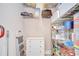 Organized walk-in closet with shelving, drawers, and storage containers for efficient storage solutions at 2566 Lake Manor Dr, Land O Lakes, FL 34639