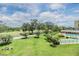 Scenic aerial view of the community, showcasing lush greenery, a pool, and other amenities at 2621 Cove Cay Dr # 302, Clearwater, FL 33760