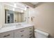 Bathroom with a white vanity, stone countertops, and a toilet at 2621 Cove Cay Dr # 302, Clearwater, FL 33760