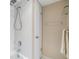 Clean bathroom featuring a shower/tub combination with white tiling and a towel rack at 2621 Cove Cay Dr # 302, Clearwater, FL 33760