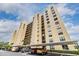 Exterior view of a high-rise building with covered parking at 2621 Cove Cay Dr # 302, Clearwater, FL 33760