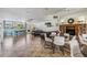 Community room with stone fireplace, television, and dining and living area seating at 2621 Cove Cay Dr # 302, Clearwater, FL 33760