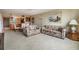 Open concept living area with tiled floors and access to the kitchen and dining area at 2621 Cove Cay Dr # 302, Clearwater, FL 33760