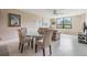 Living area with neutral walls, tiled floors, and a dining table at 2621 Cove Cay Dr # 302, Clearwater, FL 33760