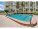 Resort-style pool with clear blue water and palm trees offers a refreshing escape and scenic views at 2621 Cove Cay Dr # 302, Clearwater, FL 33760