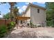 Inviting backyard patio with pergola, brick pavers, lush greenery, and outdoor seating area at 2900 W Estrella St, Tampa, FL 33629
