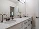 Bathroom featuring double sinks, granite counters, and modern fixtures at 2900 W Estrella St, Tampa, FL 33629
